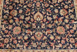 A Kashmir fringed rug with vine design o