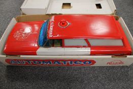 A Pico tin plated battery operated fire service vehicle, 'bump n' go' action, boxed. CONDITION