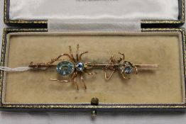 A 9ct gold spider bar brooch set with bl