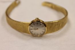 An 18ct gold Omega lady's wrist watch. CONDITION REPORT: Gross weight 34.2g. Good condition.
