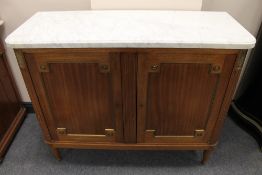An early twentieth century two drawer mahogany side cabinet with marble top, width 111 cm. CONDITION