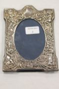 A silver embossed photograph frame, 15 cm x 19 cm overall. CONDITION REPORT: Good condition,