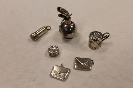 Two silver miniature stamp cases, together with a small silver flask, silver miniature cup holder,