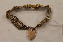A 9ct gold gate-bracelet, 16.9g. CONDITION REPORT: Good condition. The yellow metal links