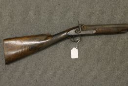 A nineteenth century hammer action rifle