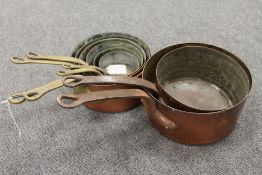 Eight French copper saucepans. (8) CONDITION REPORT: Good time aged condition.