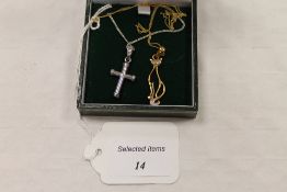 A 9ct gold cat pendant on chain, together with a 9ct white gold crucifix on chain. (2) CONDITION