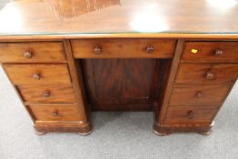 A Victorian mahogany knee hole desk, wid