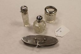 Four silver topped dressing table items. (4) CONDITION REPORT: Lot includes nail buffer, silver