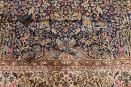 A Kashmir fringed rug with flora and fau