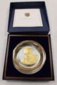 A limited edition John Pinches gold on sterling silver Churchill centenary plate, cased with