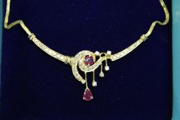 A 22ct gold ruby and diamond necklace.