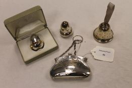 A silver purse, Birmingham 1918, together with a silver pepper pot, silver bell pin cushion and a