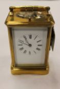 A brass striking carriage clock, height 13 cm. CONDITION REPORT: Good condition, ticking away,