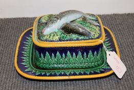 A nineteenth century majolica sardine dish and cover, with stand, width 21.5 cm. CONDITION REPORT: