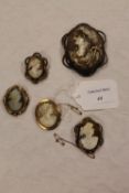 A 9ct gold cameo brooch, together with four other nineteenth century cameos mounted in yellow metal.