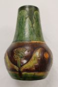 An early twentieth century studio pottery vase decorated with thistle decoration, height 26.5 cm.
