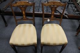 A pair of Victorian inlaid rosewood salon chairs.