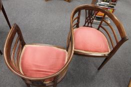 An Edwardian inlaid mahogany love seat,