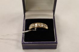 A 14ct gold nine stone diamond ring. CONDITION REPORT: Good condition.