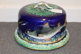 A nineteenth century majolica dish and cover, with fish decoration, diameter 26.5 cm. CONDITION