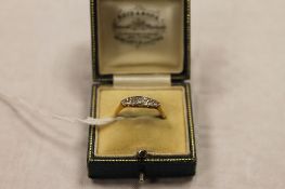 An 18ct gold five stone diamond ring. CONDITION REPORT: Good condition.