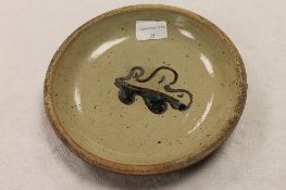 A Leach Pottery St. Ives stoneware dish decorated with an oak leaf, width 21 cm. CONDITION REPORT: