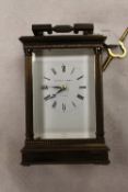 A brass carriage clock by Matthew Norman, with key, height 14.5 cm. CONDITION REPORT: Condition