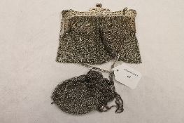 A Victorian chain evening purse, together with a smaller white metal chain purse. (2) CONDITION