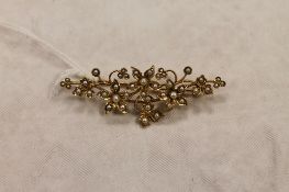 A 15ct gold seed pearl floral brooch, width 5.5 cm, 6g. CONDITION REPORT: Good condition.