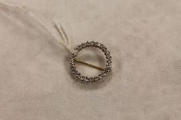 A 9ct gold circular diamond brooch, diameter 19 mm.  CONDITION REPORT: Good condition.
