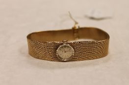 An 18ct gold Longines Lady's wrist watch, 45.3g, with original retail guarantee. CONDITION REPORT: