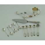 Small silver mug; six condiment spoons;