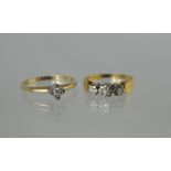 Diamond three stone ring in 18ct gold, 1