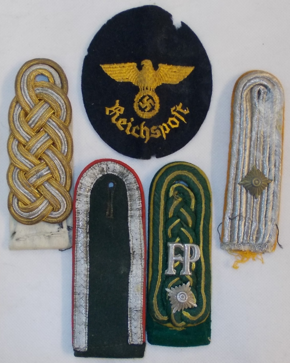 German. Four various shoulder epaulettes