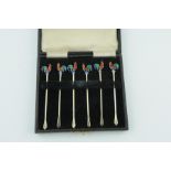 Set of six silver cocktail sticks with e