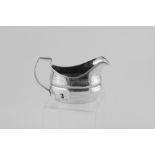 Silver cream jug, ovoid with engraved ba