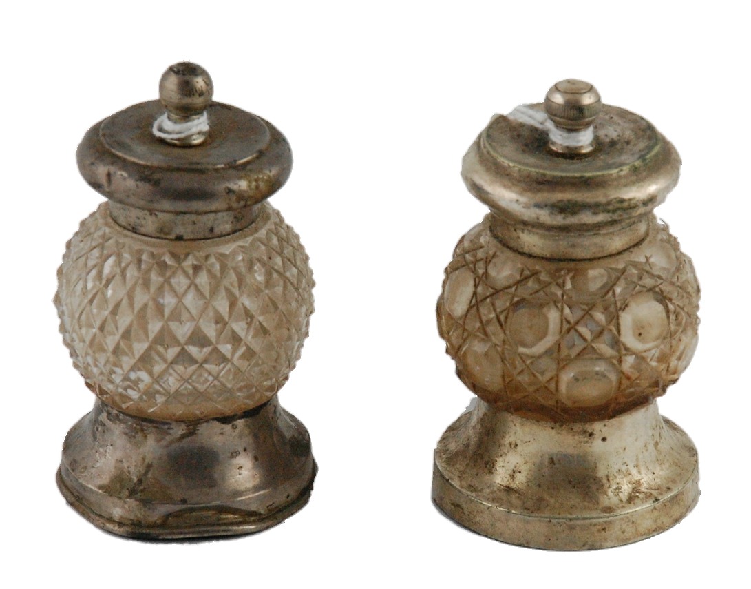 Cut glass pepper mill with silver mounts,1901 & another, e.p. mounts.  (2).