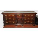 18th century oak low dresser, the moulded edge rectangular top above two tiers of three drawers,