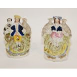 Pair of Staffordshire figures of a girl & a young man with flute,