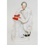 Staffordshire figure of William Shakespeare supported on a pile of books upon a column,