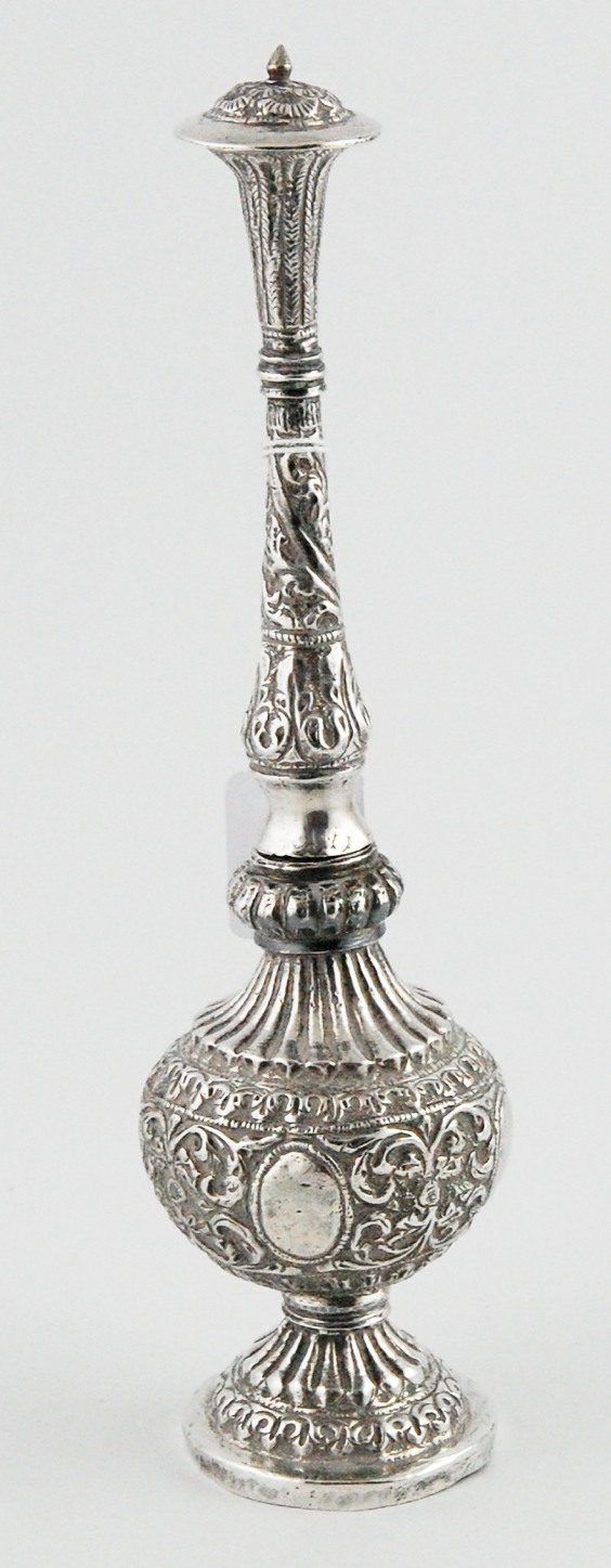 Indian silver water shaker of typical slender form, embossed all over, 10 oz gross.