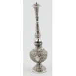 Indian silver water shaker of typical slender form, embossed all over, 10 oz gross.