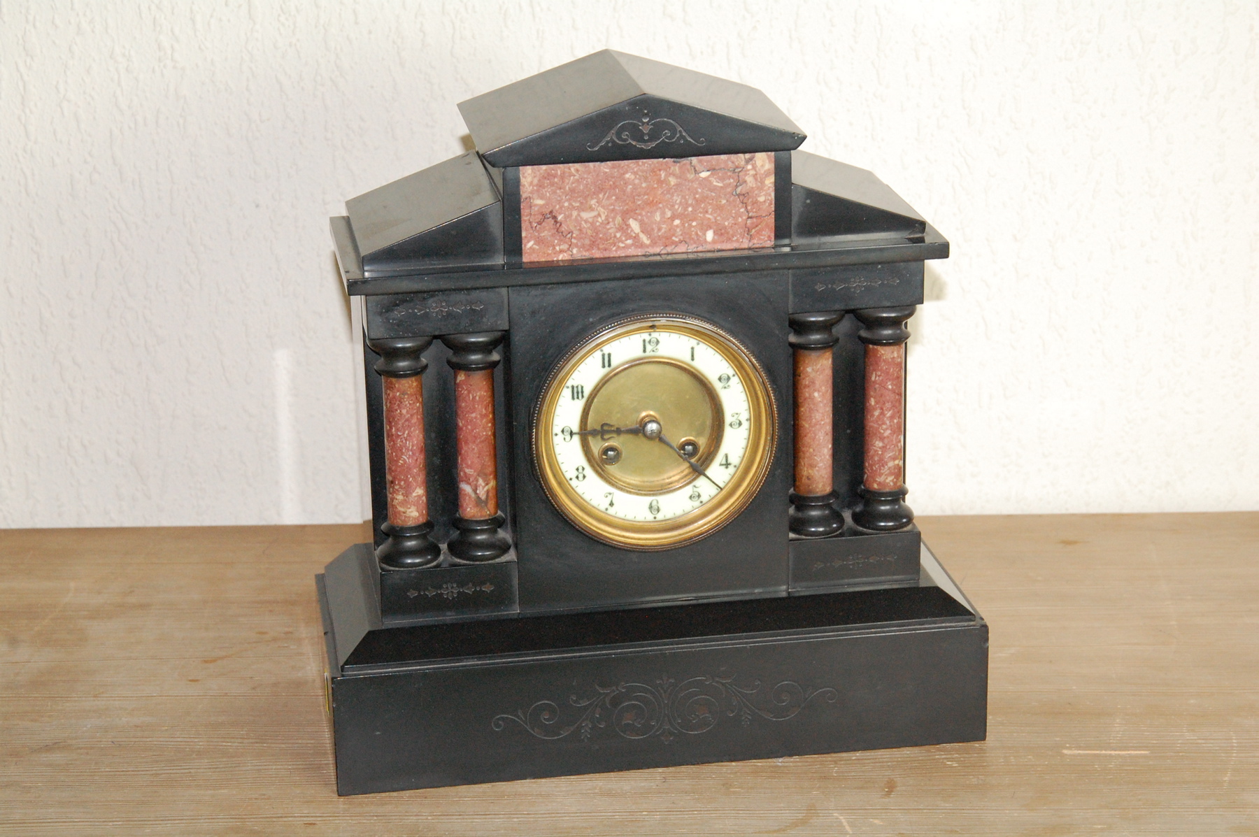 French mantel clock in Namur marble case of architectural style with paired columns & pediment, 13".