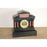 French mantel clock in Namur marble case of architectural style with paired columns & pediment, 13".