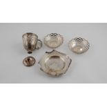 Silver embossed cup, the foot detached, 1865; two pierced circular dishes & another, hammered.