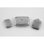 Silver small snuff box engraved all over with scrolls & two similar vesta cases,