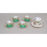 Set of four Royal Worcester green ground coffee cans with saucers,