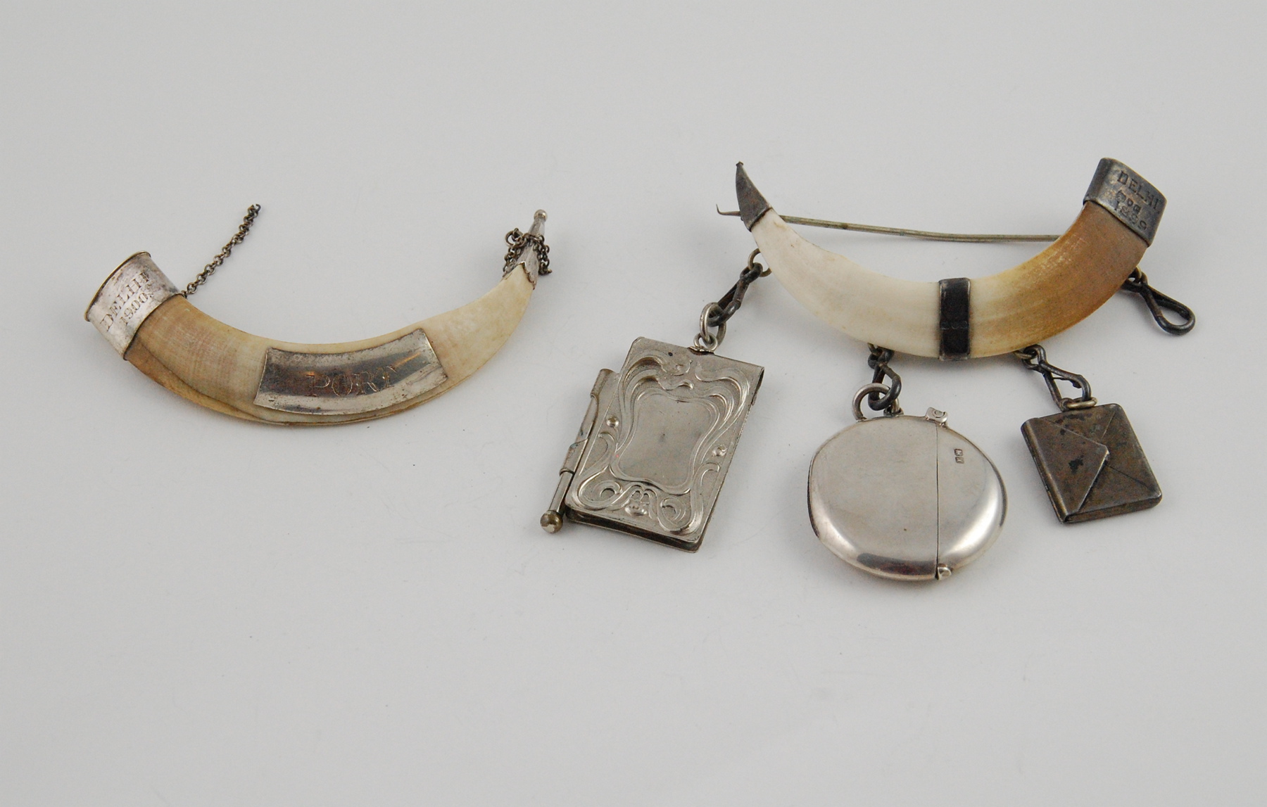 Pair of silver mounted wart hog tusks, 'Delhi 1899' (London), 1900,