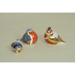 Three Royal Crown Derby paperweights, quail, 3" long (lacking button); robin,